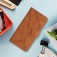 Stitched Embossed PU Leather + TPU Wallet Case with Stand & Wrist Strap for iPhone 17 Pro Max - Brown